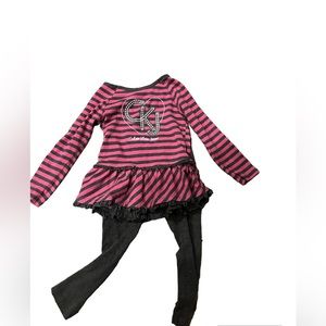 Long sleeved winter shirt with gray pants designed by Calvin Klein